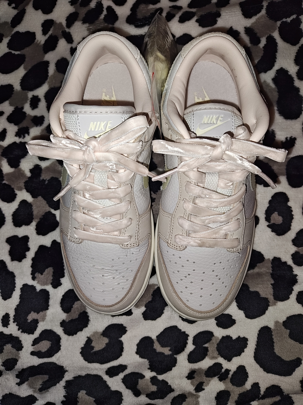 Nike Women’s Low-Top Sneakers in Pale Pink with Gold Logo